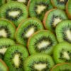 Vibrant, fresh kiwi slices arranged close-up, highlighting their juicy and nutritious appeal.